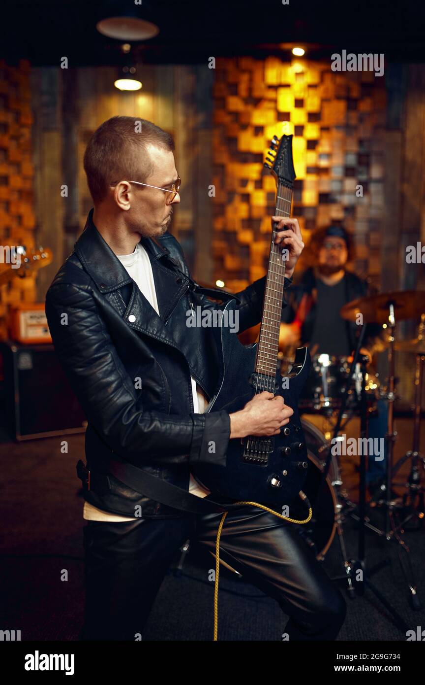 Male artist with electric guitar, music performing Stock Photo Alamy