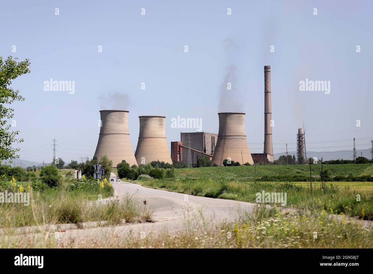 Thermal power plant (TPP) Bobov dol with illegal burning of waste on june, 2021. TEC or TETs Bobov dol with high air pollution on a blue sky. RDF Stock Photo