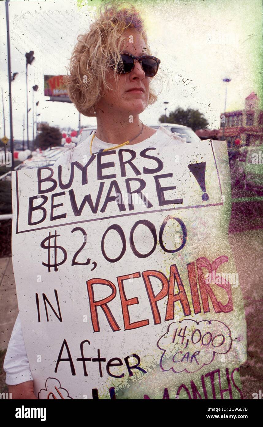 Austin, Texas USA,1993 Female consumer protesting car dealership where