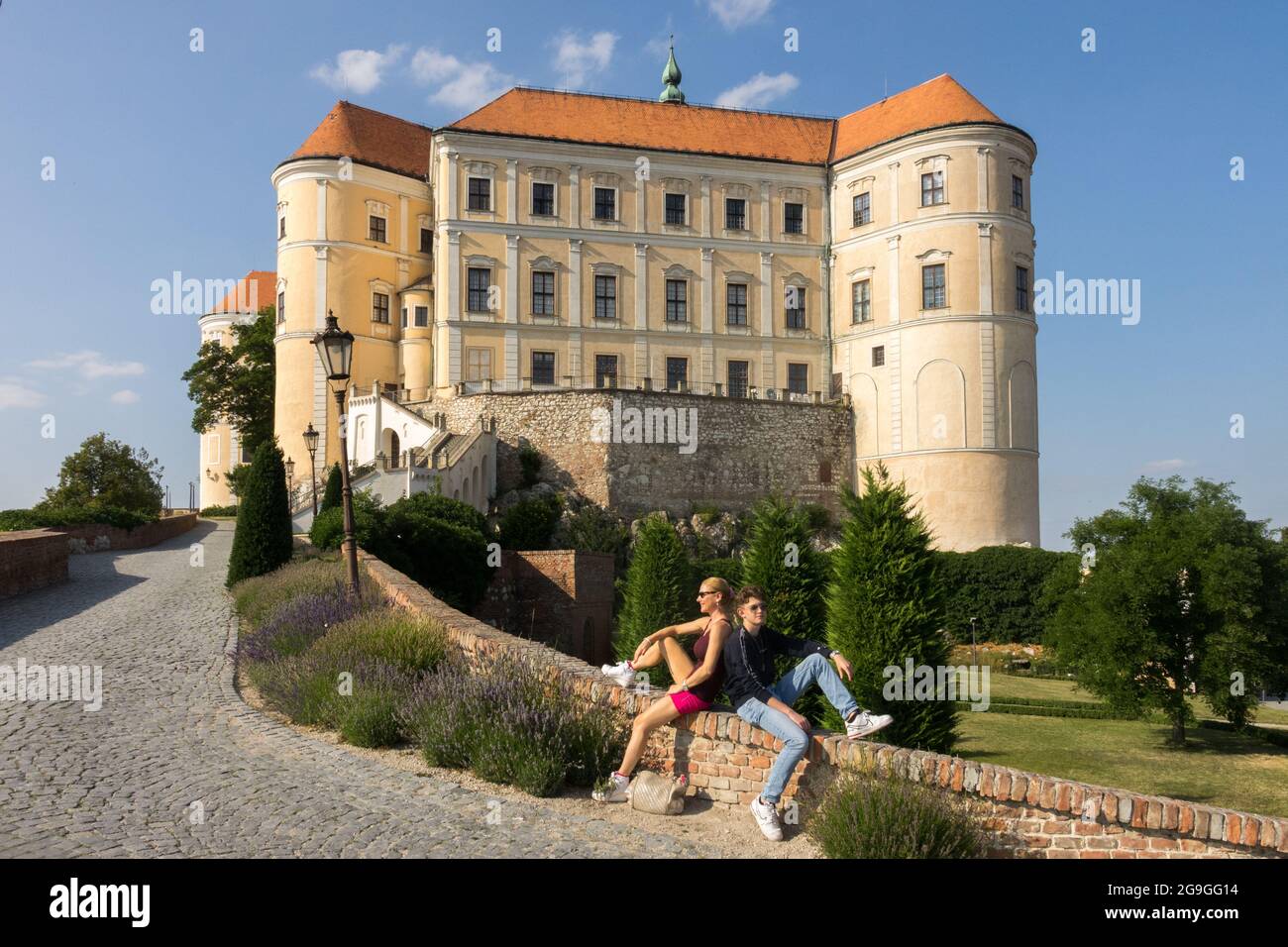 Two tourists in Castle garden at the road, Mikulov Castle Czech Republic Stock Photo