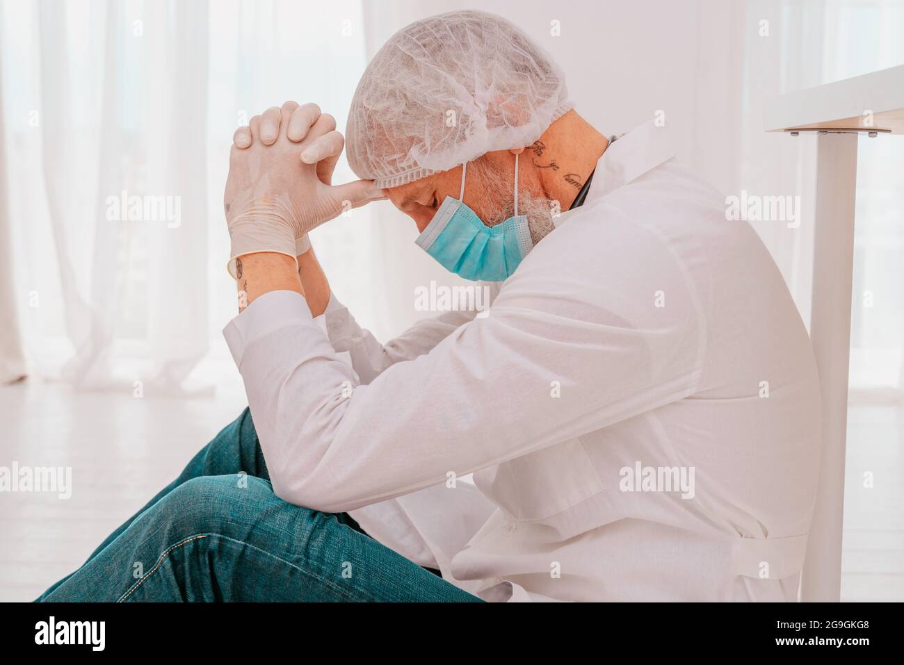 Tired doctor hi-res stock photography and images - Alamy