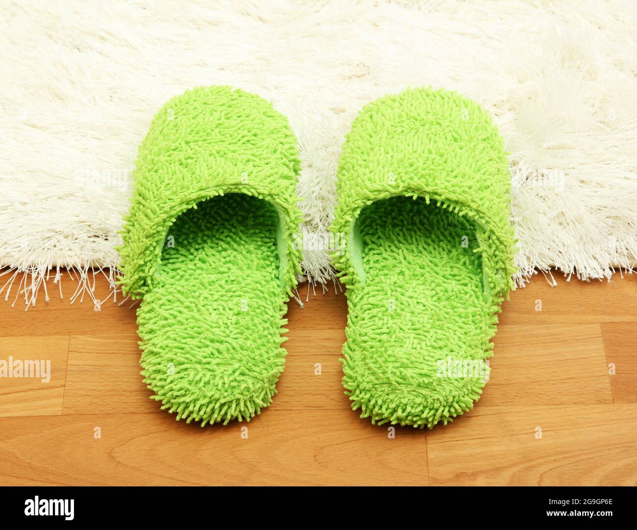 bright slippers, on floor background Stock Photo - Alamy