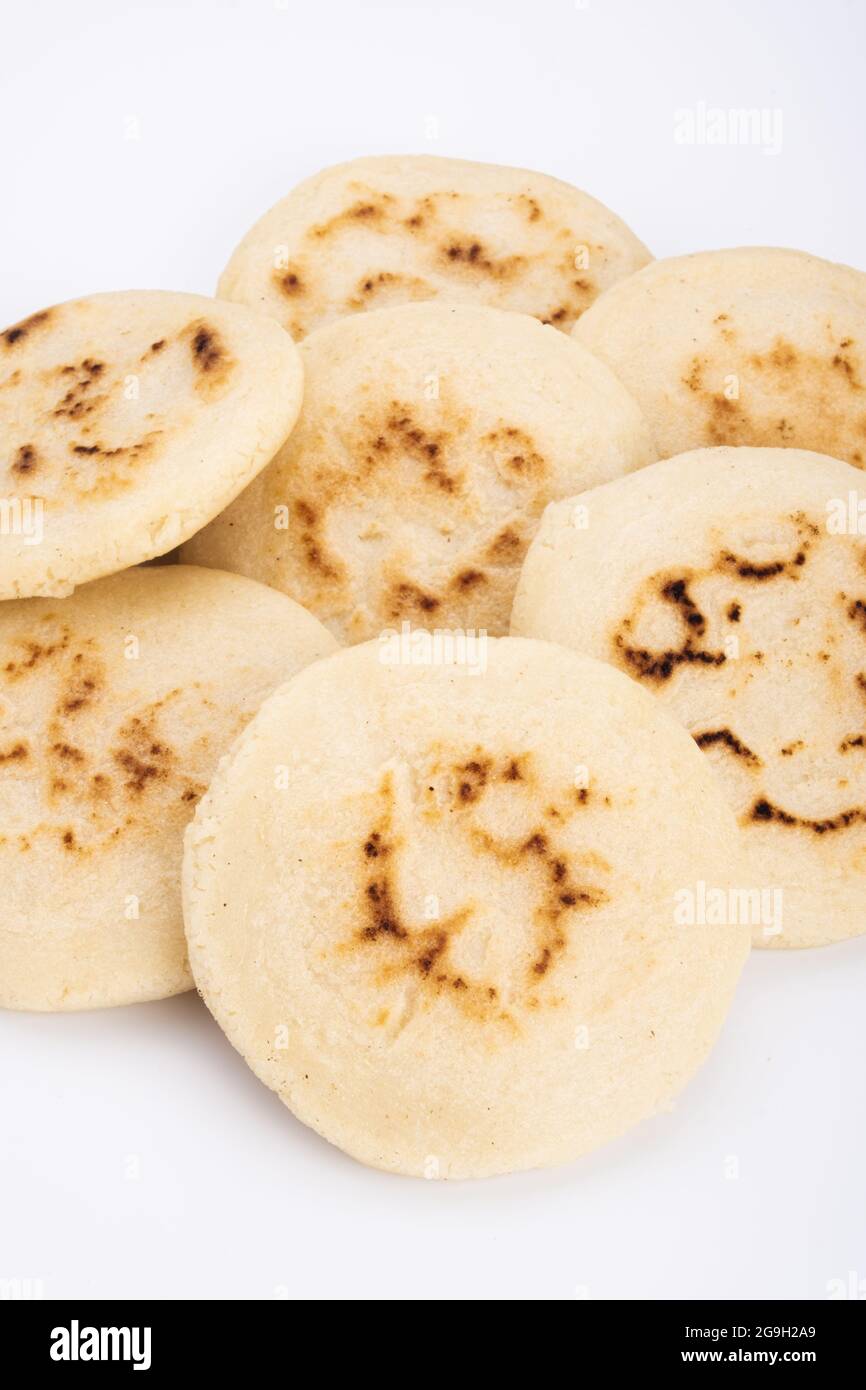 Stack of arepas made with corn flour on a white background, typical Latin American food Stock Photo