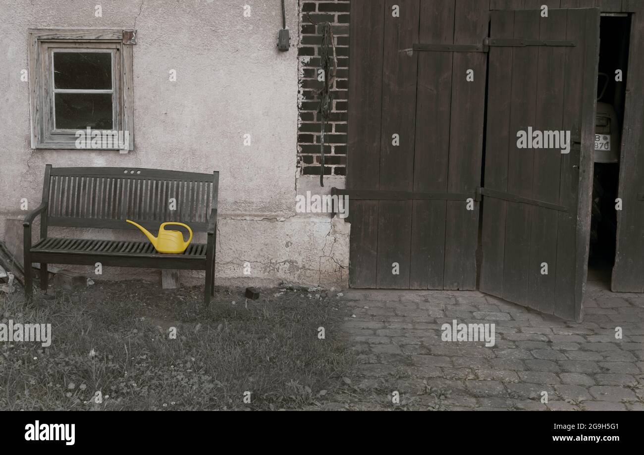 Old bench in front of the house Stock Photo - Alamy