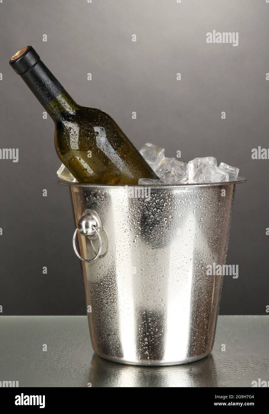 Bottle of wine in ice bucket on black background Stock Photo Alamy