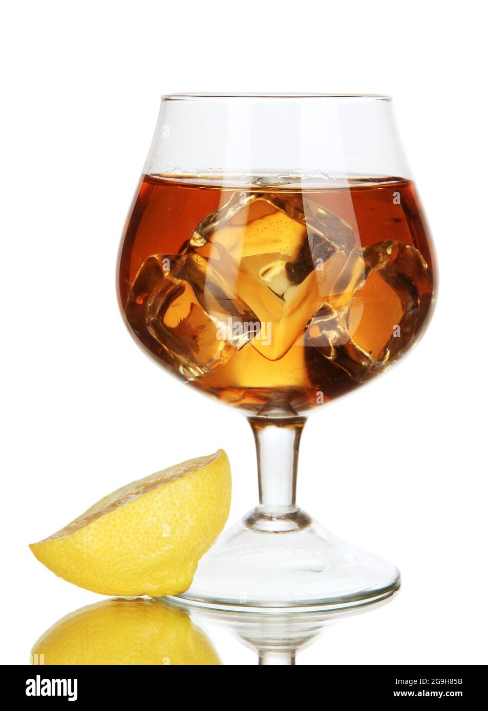 Glass of brandy with ice and lemon isolated on white Stock Photo Alamy