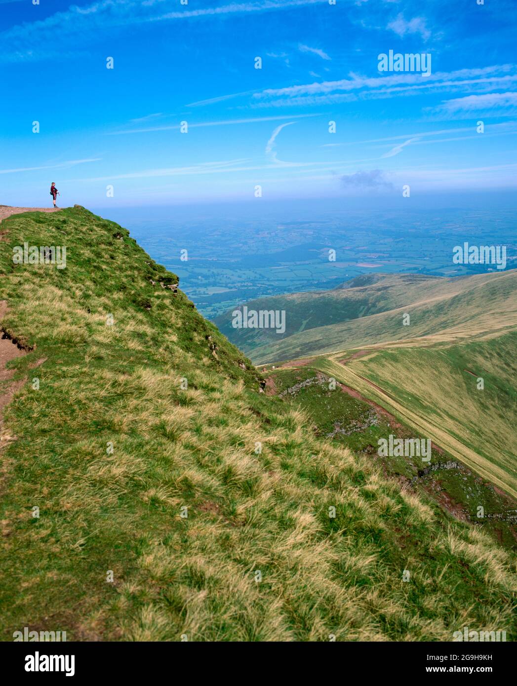 walker on summit of pen y fan, brecon beacons, powys wales. Stock Photo