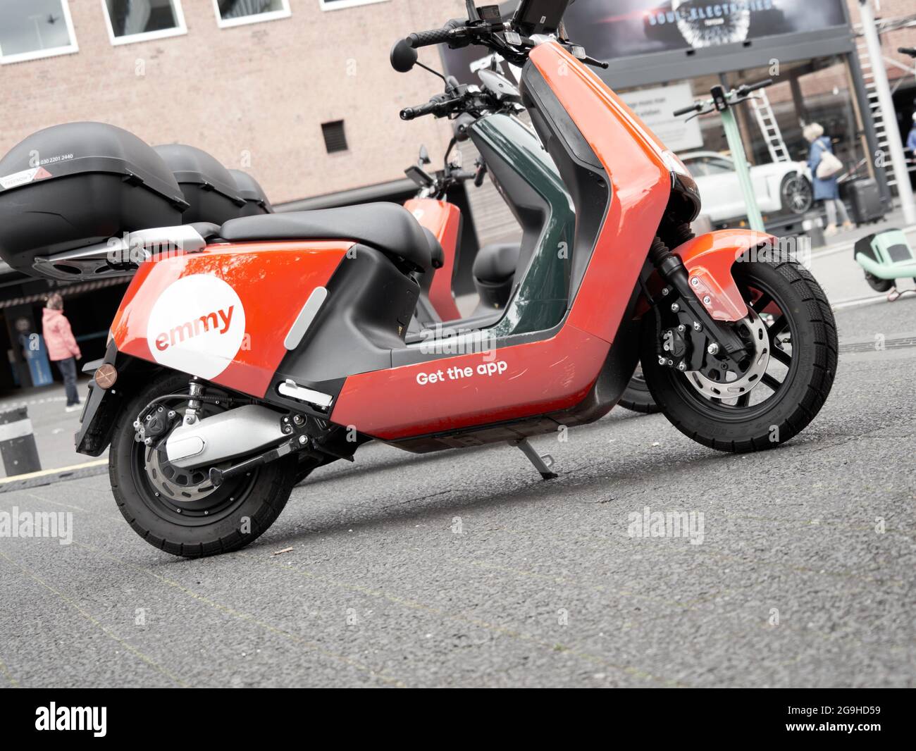 Emmy rent scooter in red paint on a public square in Hamburg, Germany, July  22, 2021 Stock Photo - Alamy