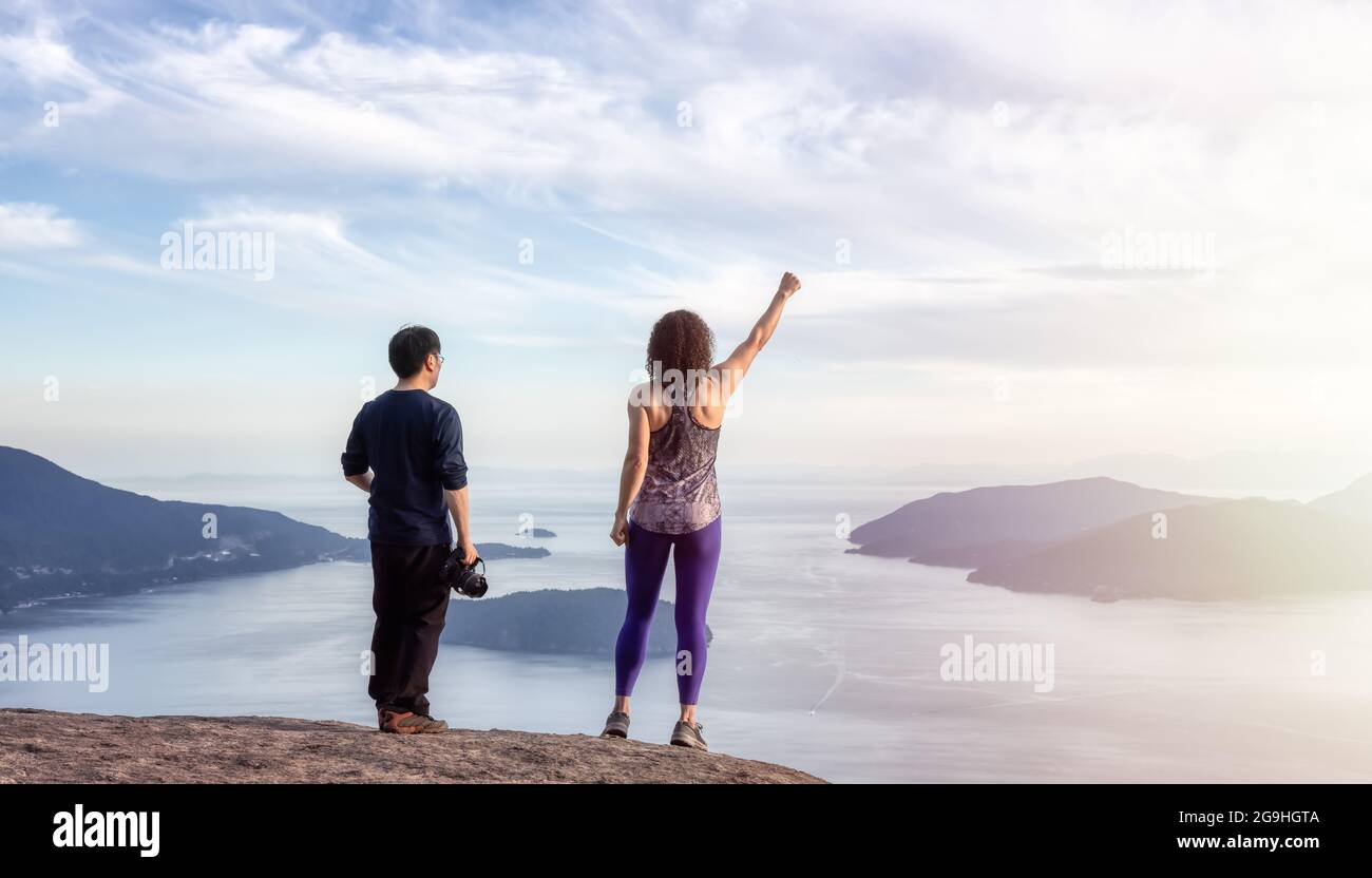 Friends hiking on top of Canadian Mountain Landscape Stock Photo - Alamy