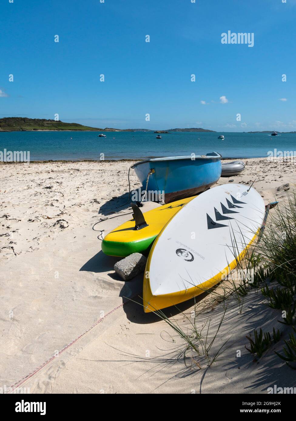 Canoes on the beach Church Quay beach, Bryher, Isles of Scilly