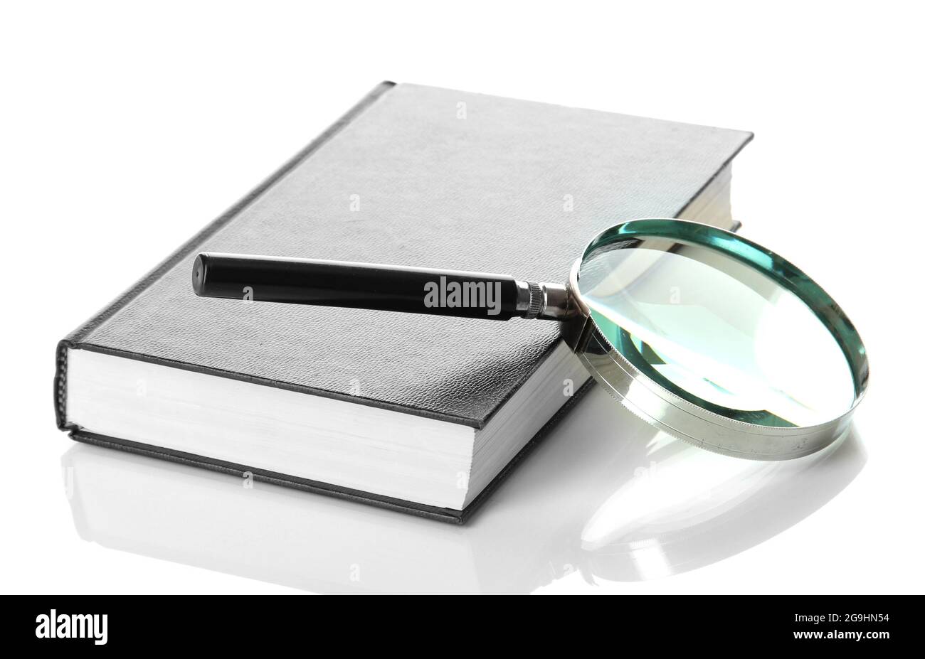 Magnifying glass and book isolated on white Stock Photo - Alamy