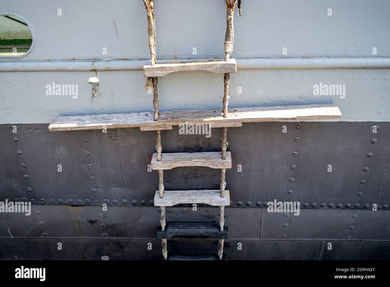 pilot ladder on old cargo vessel with reveted hull  for the embarking and disembarking pilots Stock Photo