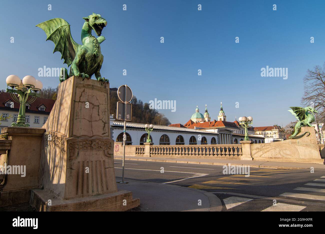 Two dragon statues on Ljubljanas Dragon bridge on a bright sunny day, Ljubljana, Slovenia Stock Photo