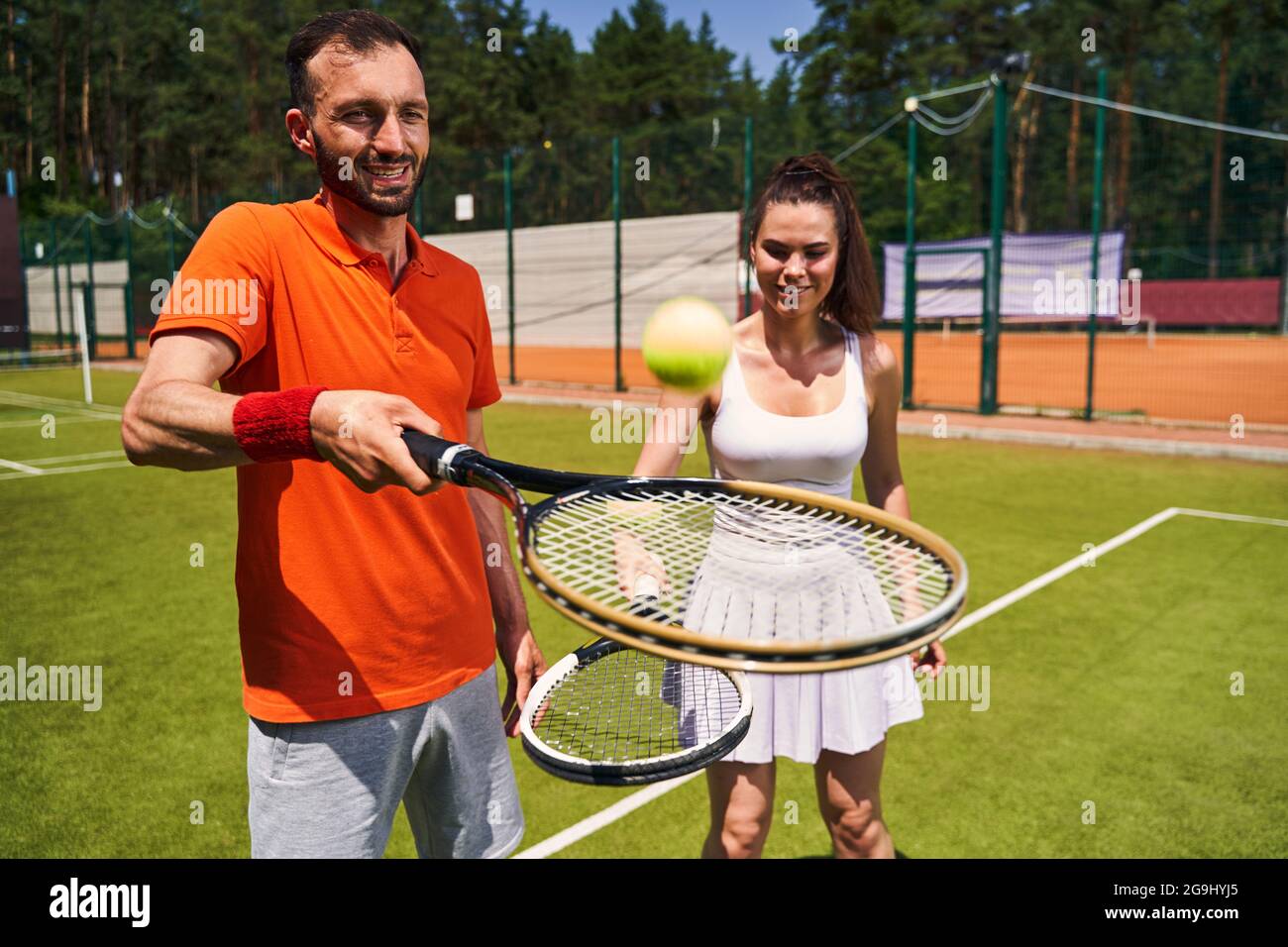 Beginner woman player learning to play tennis Stock Photo Alamy