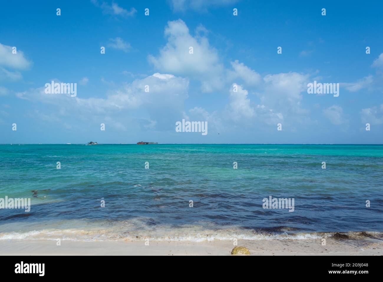 Sunny day by the beach at the island of San Andrés, Colombia. Blue skies and clear water. Stock Photo