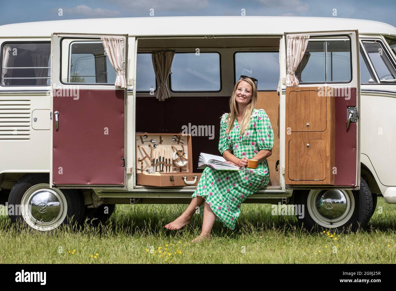 Family at Woodfire Camping near Petworth in West Sussex with a 1966 retro VW campervan, England, United Kingdom Stock Photo