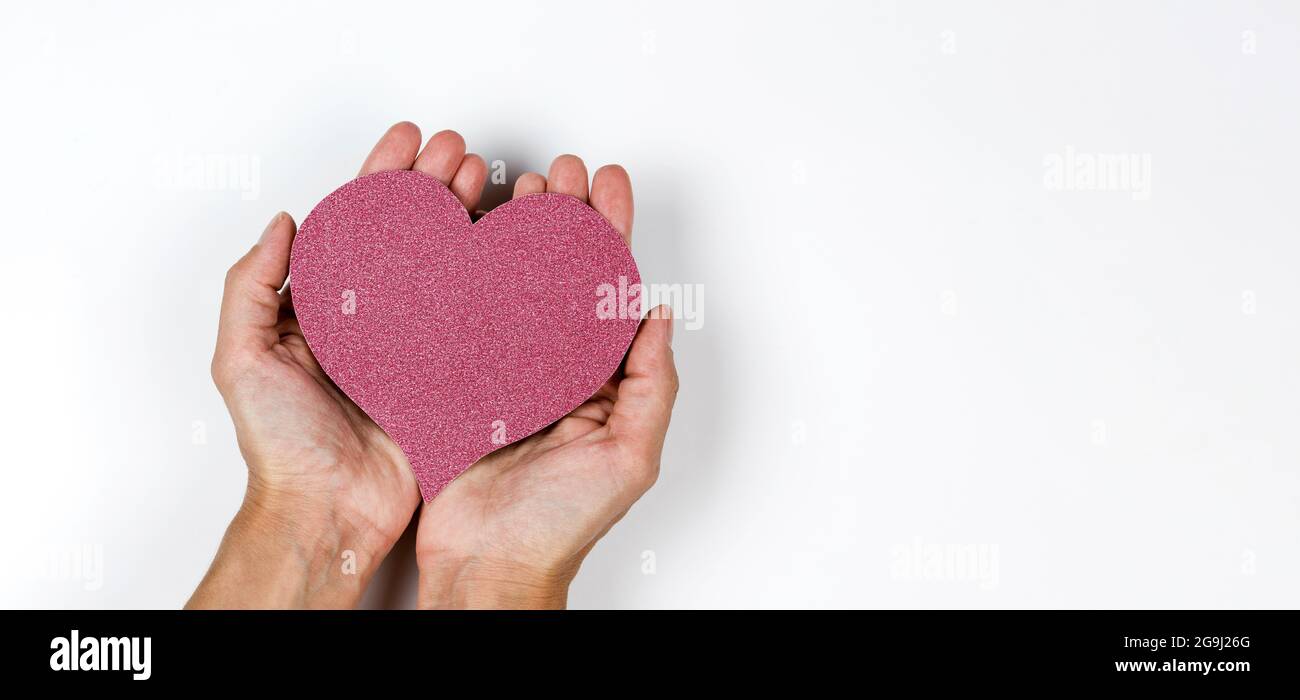 Red paper heart in woman's hands on white background Stock Photo - Alamy