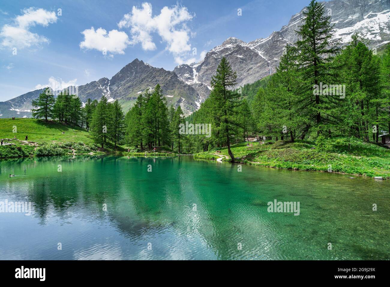 The scenic Blue Lake (Lago Blu) surrounded by a beautiful alpine landscape near Cervinia, Aosta Valley, Italy Stock Photo