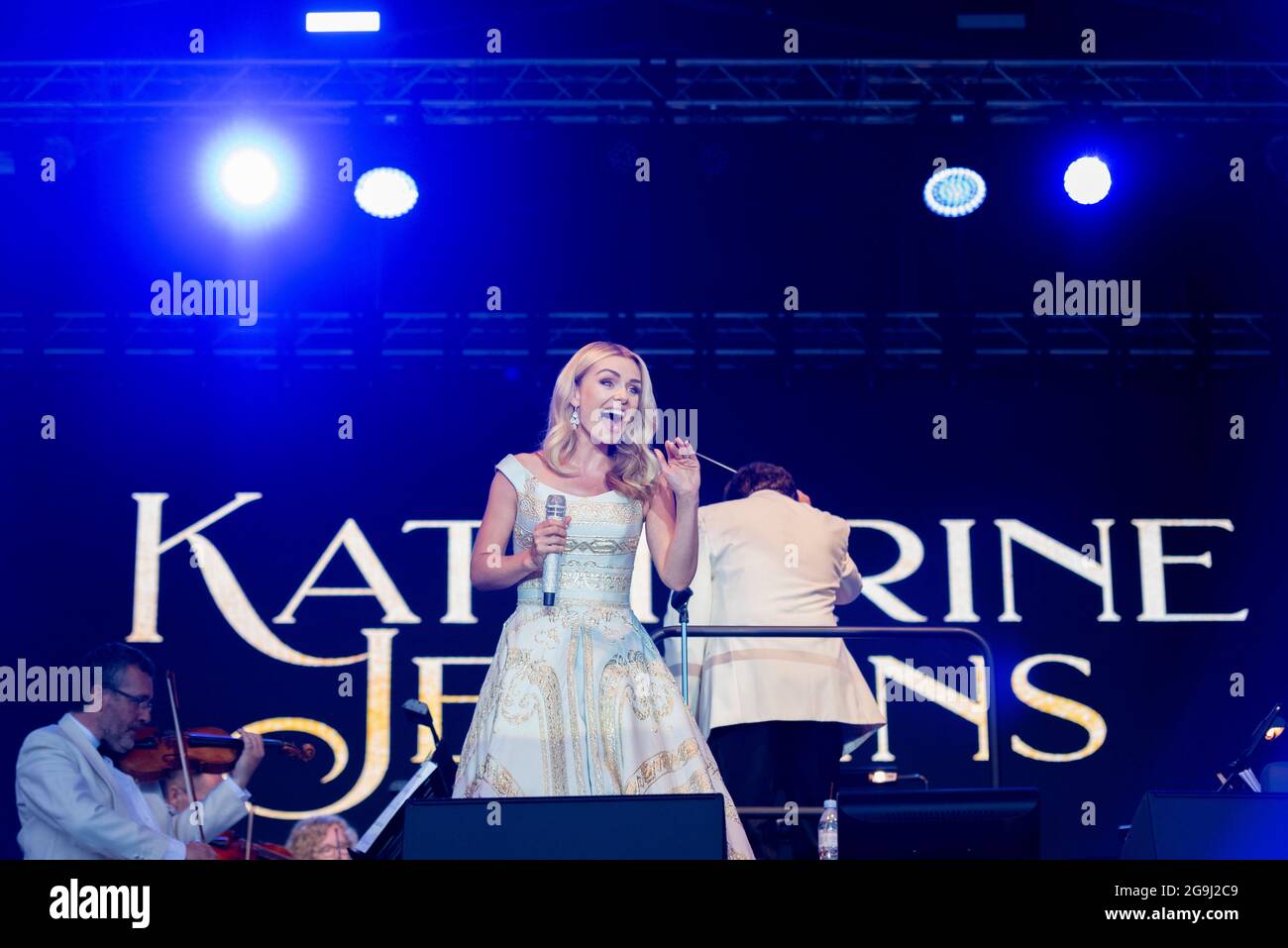 Katherine Jenkins performing on stage in Maldon, Essex, UK. Welsh female operatic singer singing with the London Concert Orchestra. Waving at audience Stock Photo