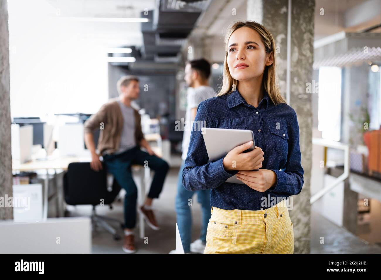 Programmers cooperating at IT company developing apps Stock Photo