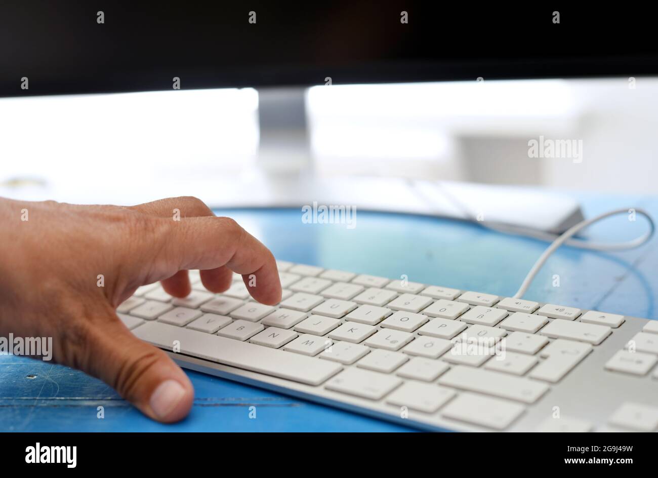 Turning the desktop computer on, hand on keyboard Stock Photo - Alamy