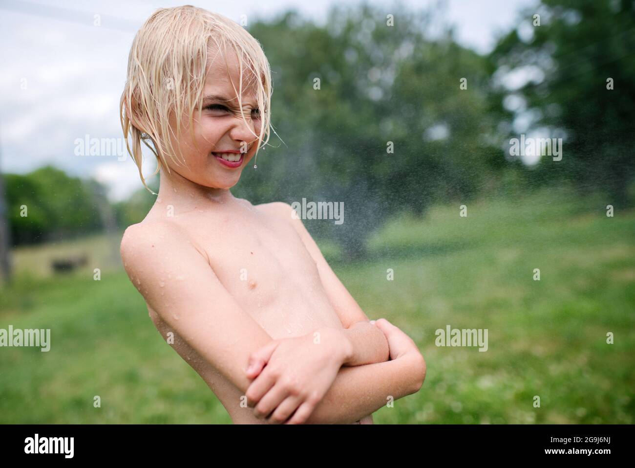 Canada, Ontario, Kingston, Wet shirtless boy (8-9) Stock Photo