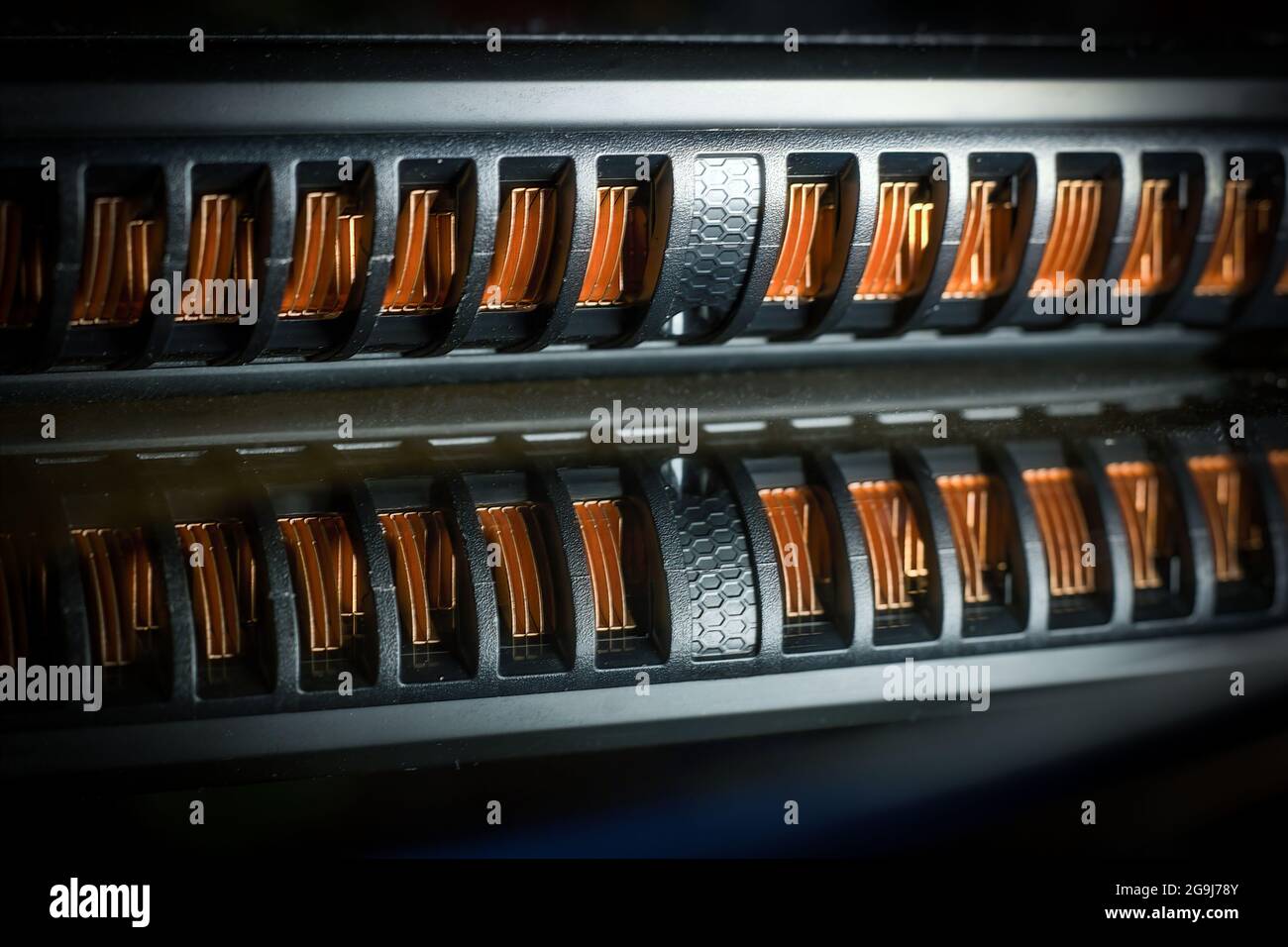 Macro photography of air vents at the side panel of a laptop or