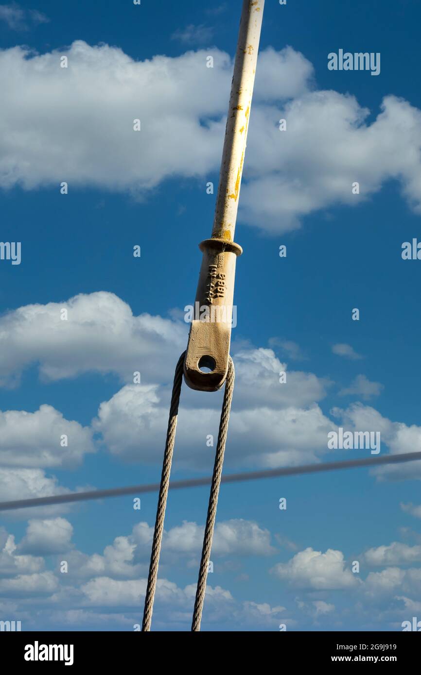 Photograph of a tensioner bracket on a transmission line Stock Photo