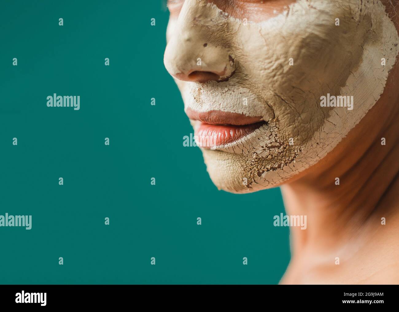 Crop female with dry clay mask Stock Photo