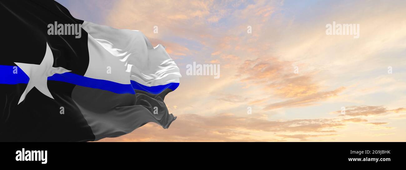 Thin Blue Line USA Texas flag waving at cloudy sky background on sunset
