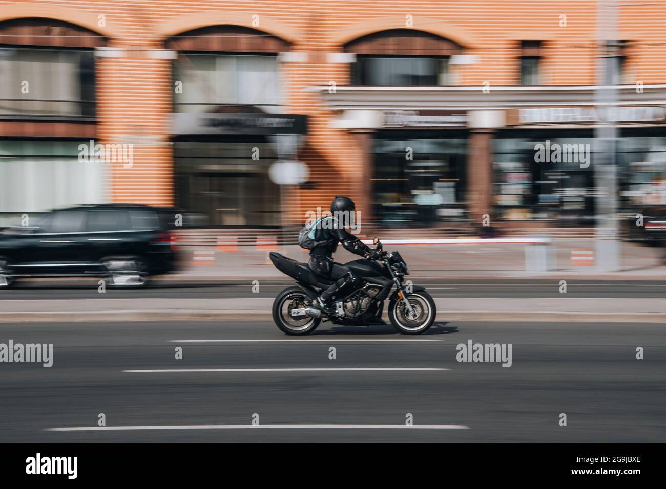 Ukraine, Kyiv - 16 July 2021: Black Motorcyle moving on the street. Editorial Stock Photo