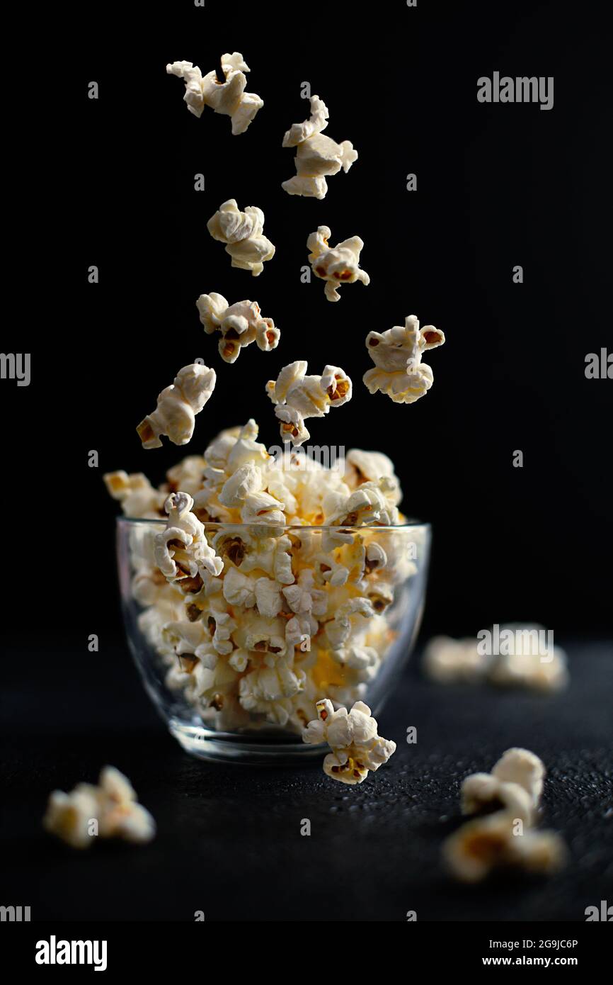 Creative concept with falling food on black backdrop Stock Photo