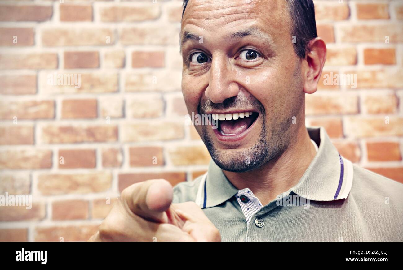 Ugly man picking his crooked teeth isolated on white Stock Photo - Alamy