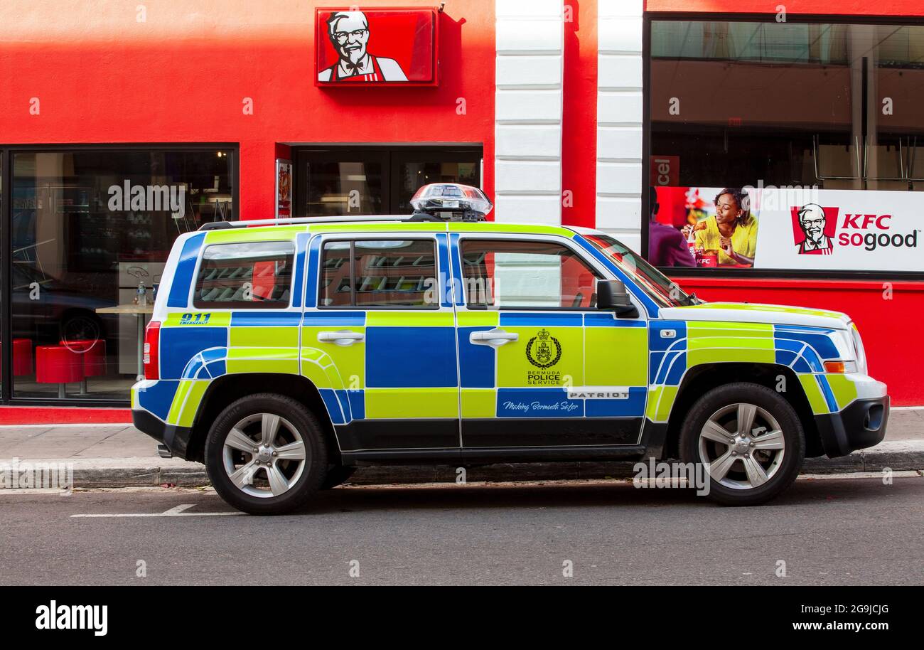 Bermuda Police Jeep Patriot SUV Vehicle Parked Outside A KFC Restaurant On Queen St, Hamilton, Bermuda Stock Photo