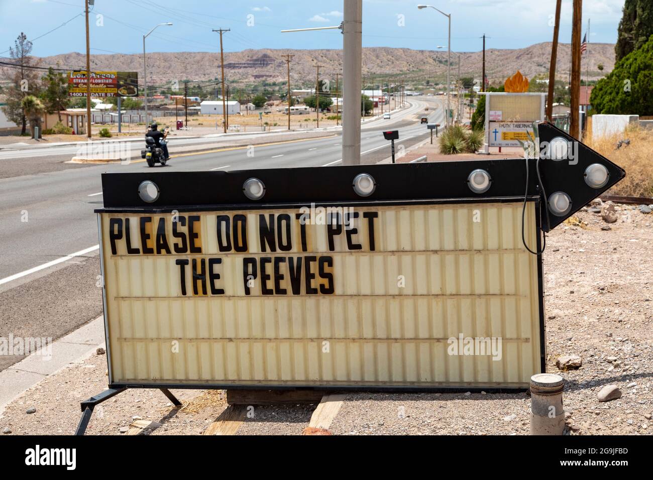 Truth or Consequences, New Mexico - A sign in front of a local business reads 'Please do not pet the peeves.' Stock Photo