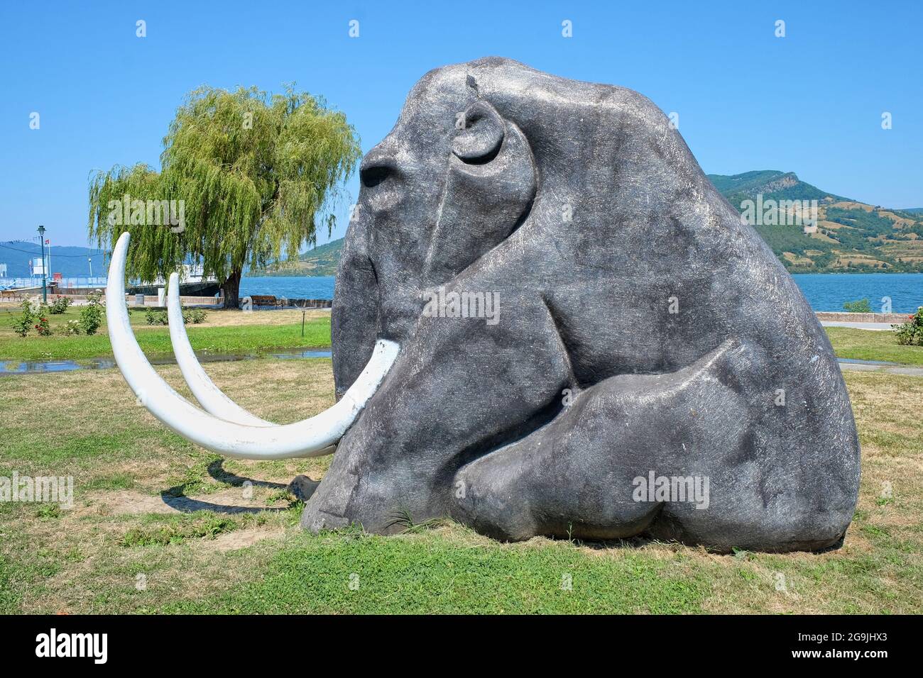DONJI MILANOVAC, SERBIA - JULY 24, 2015: this sitting mammoth statue is the unofficial mascot of the small town on the Danube River. Remains of prehis Stock Photo