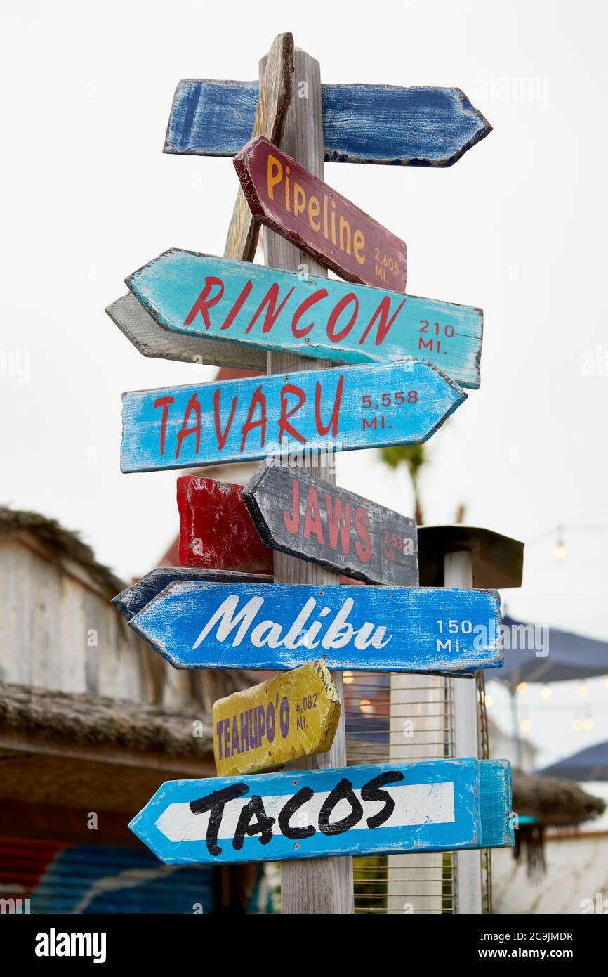 Whimsical direction signs on the beach Stock Photo