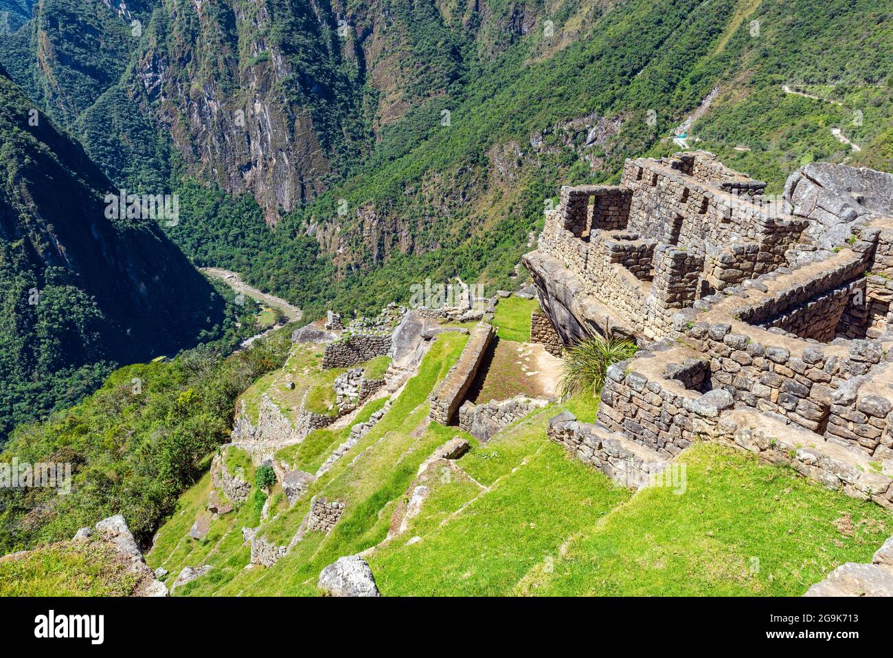 Machu Picchu agriculture terraces with inca housing building and Urubamba river, Machu Picchu