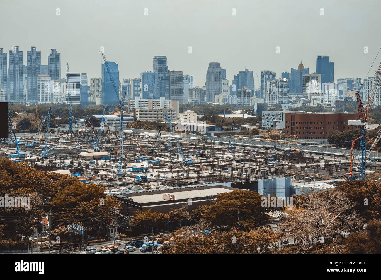 Panoramic view of cityscape and construction site in metropolis . Real estate development in downtown business district . Stock Photo