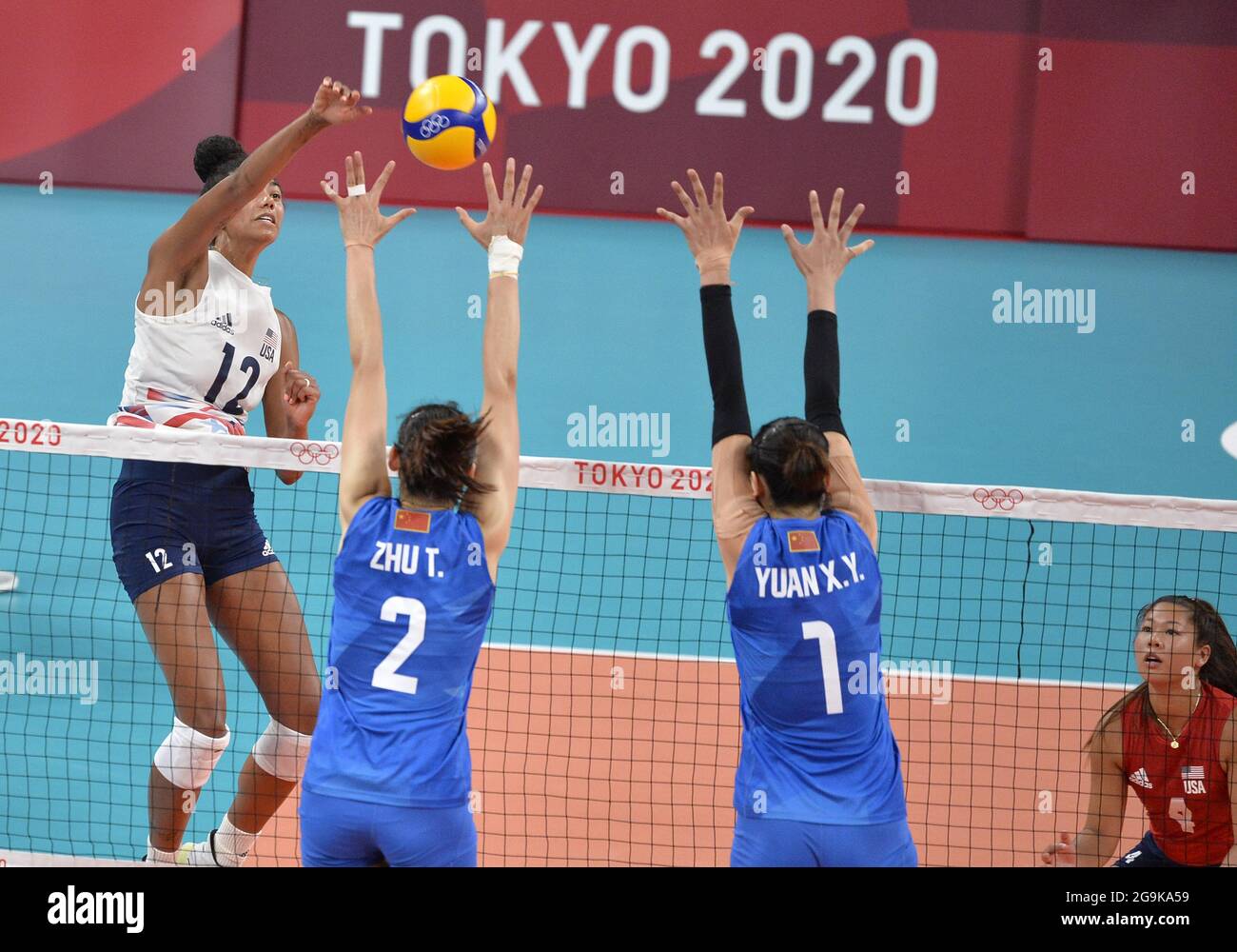 Tokyo, Japan. 27th July, 2021. USA's Jordan Thompson (12) spikes the ball against China's Ting Zhu (2) and Xinyue Yuan (1) during women's volleyball competition at the Tokyo 2020 Olympics, Tuesday, July 27, 2021, in Tokyo, Japan. USA won in two sets 29-27 and 25-22. Photo by Mike Theiler/UPI Credit: UPI/Alamy Live News Stock Photo