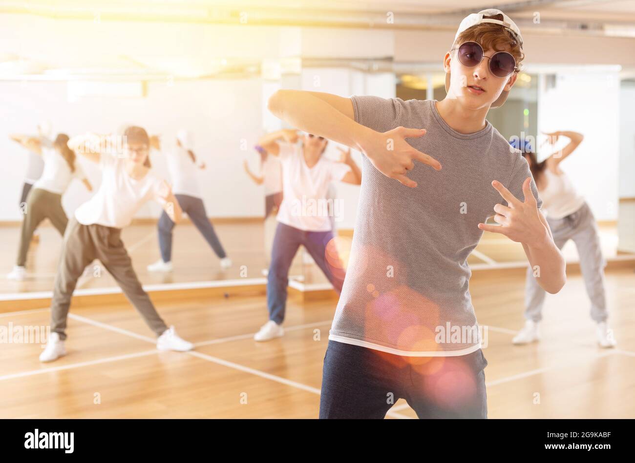 Portrait of teenager boy performing hip hop at group dance Stock Photo ...