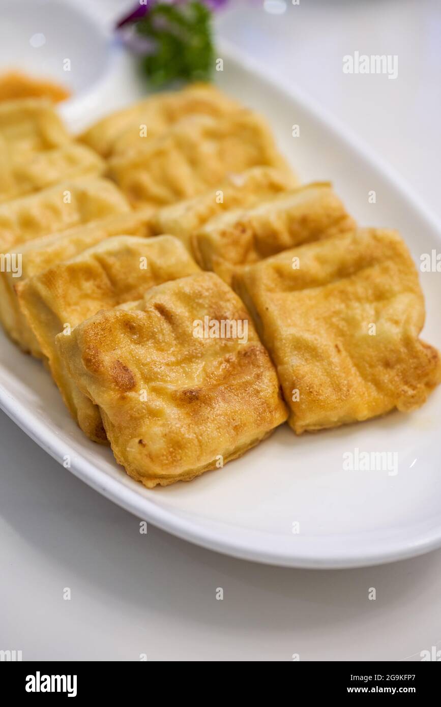 A delicious Chinese dish, deep-fried tofu with milk Stock Photo - Alamy