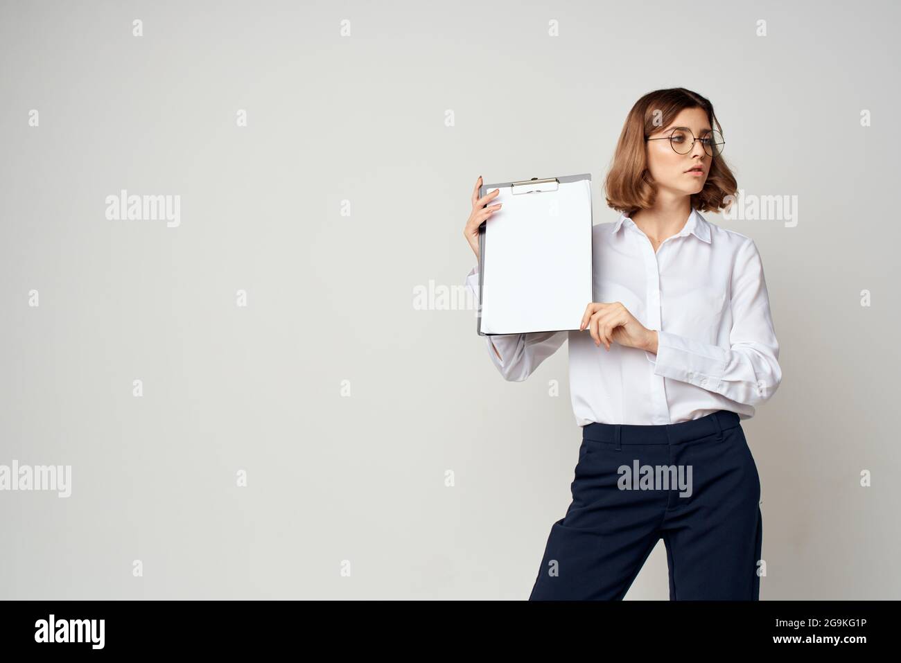 cheerful business woman with folder in hands documents office light ...