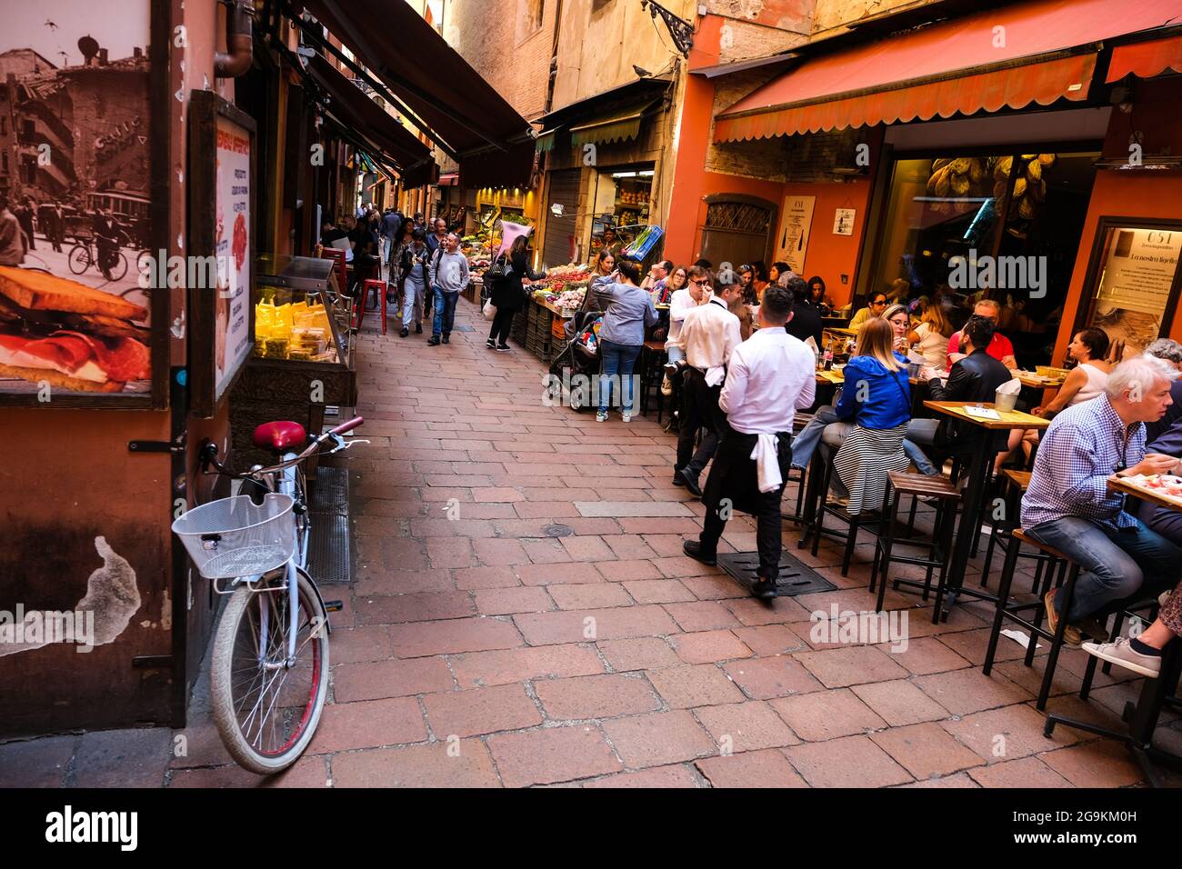 Diners enjoying the food and ambience in the Quadrilatero area of Bologna Italy Stock Photo