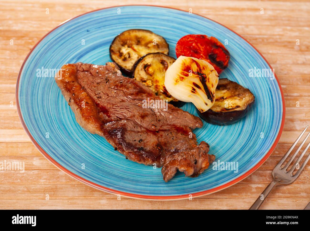 Healthy dinner of veal entrecote with grilled vegetables Stock Photo