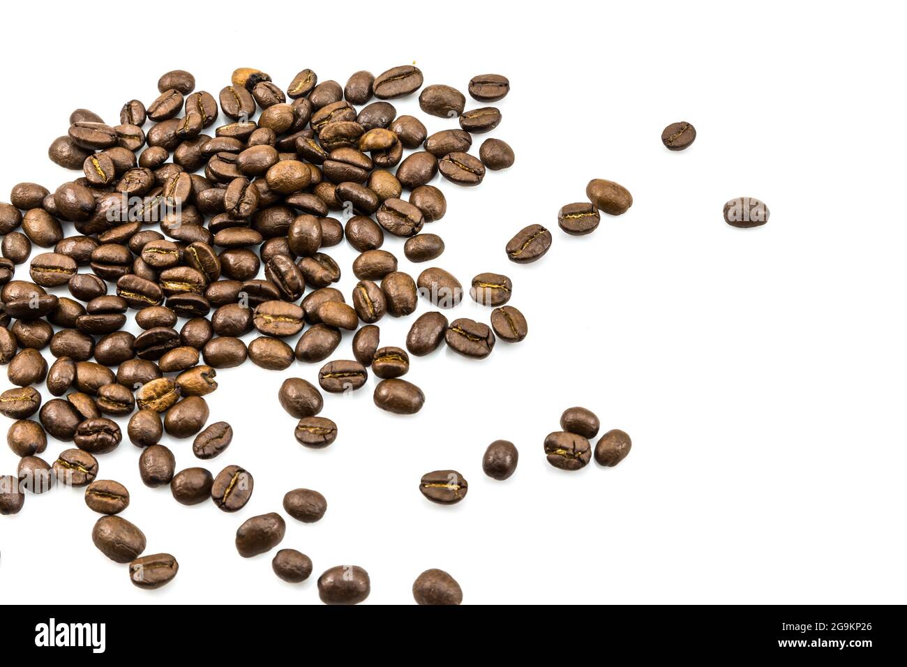 Brown coffee beans isolated on white background Stock Photo - Alamy