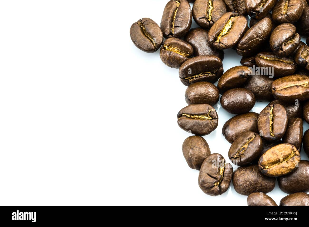 Brown coffee beans isolated on white background Stock Photo - Alamy