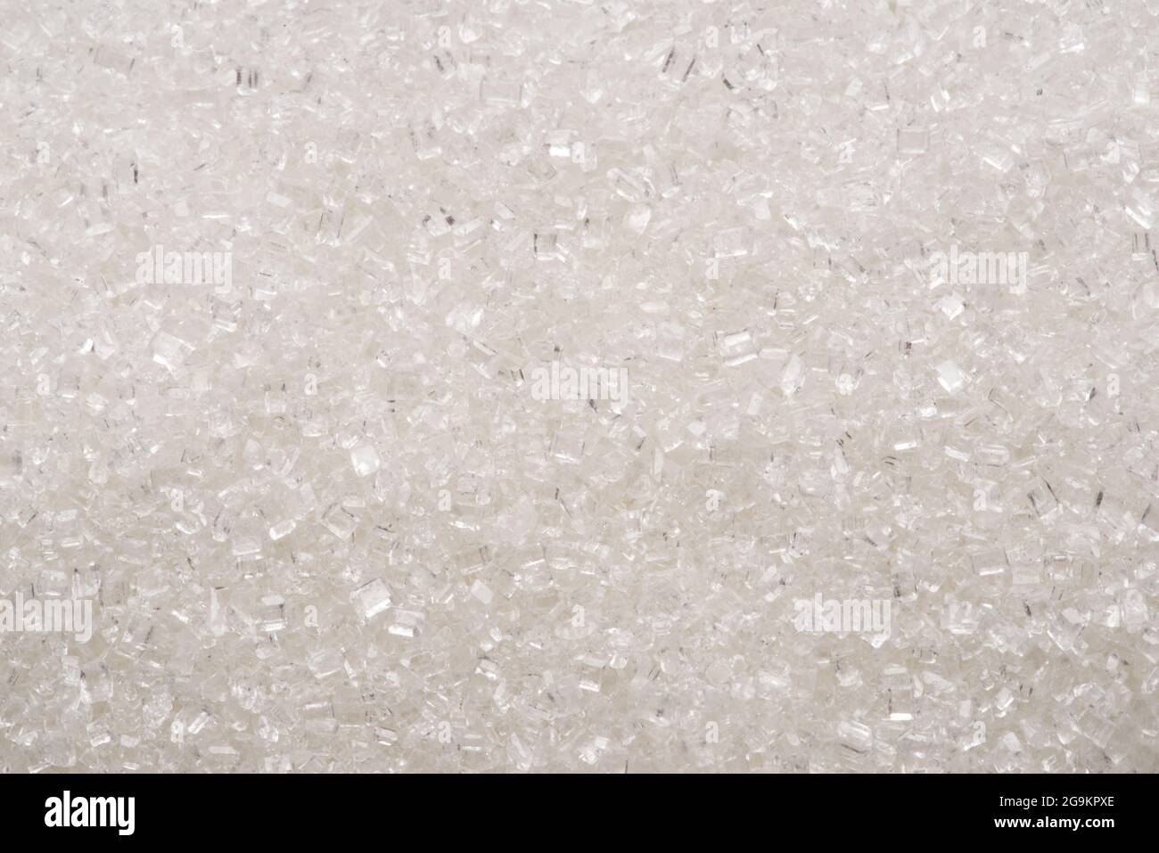 White refined sugar granules close-up. Food background. Stock Photo