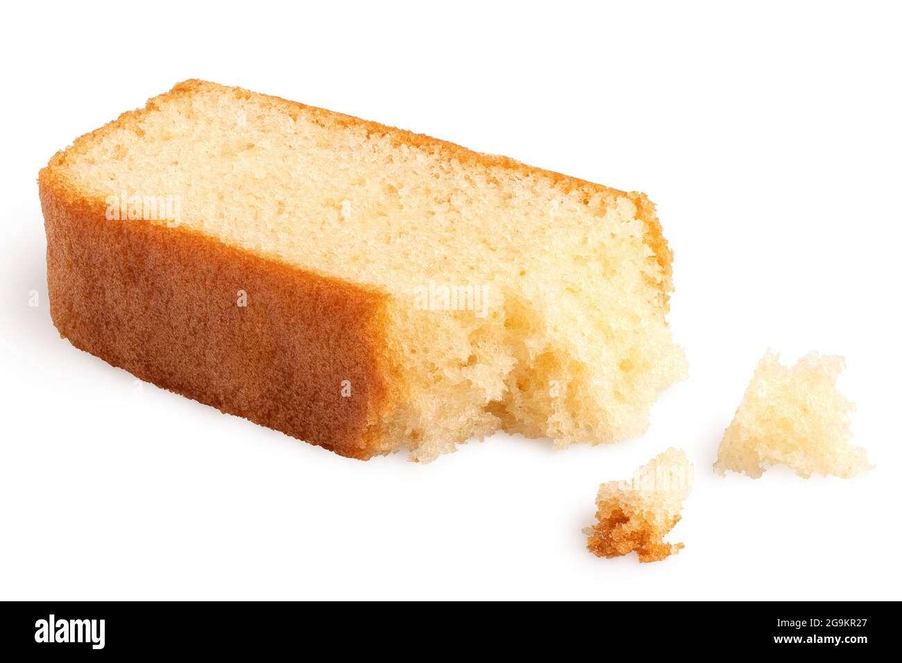 Partially eaten slice of plain sponge cake lying flat isolated on white. With crumbs. Stock Photo