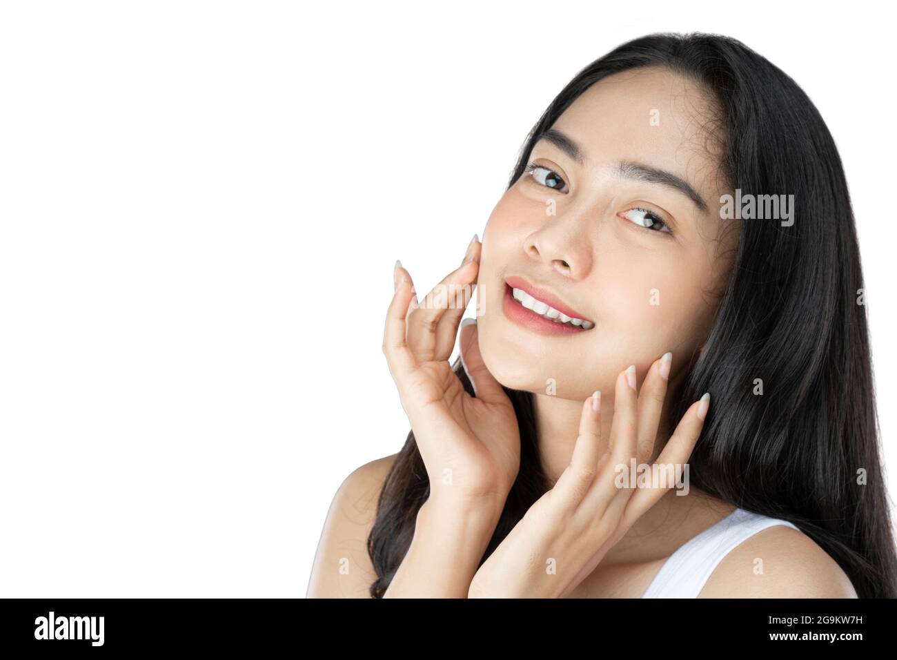 attractive girl with long black hair with both hands pose gently holding cheek Stock Photo